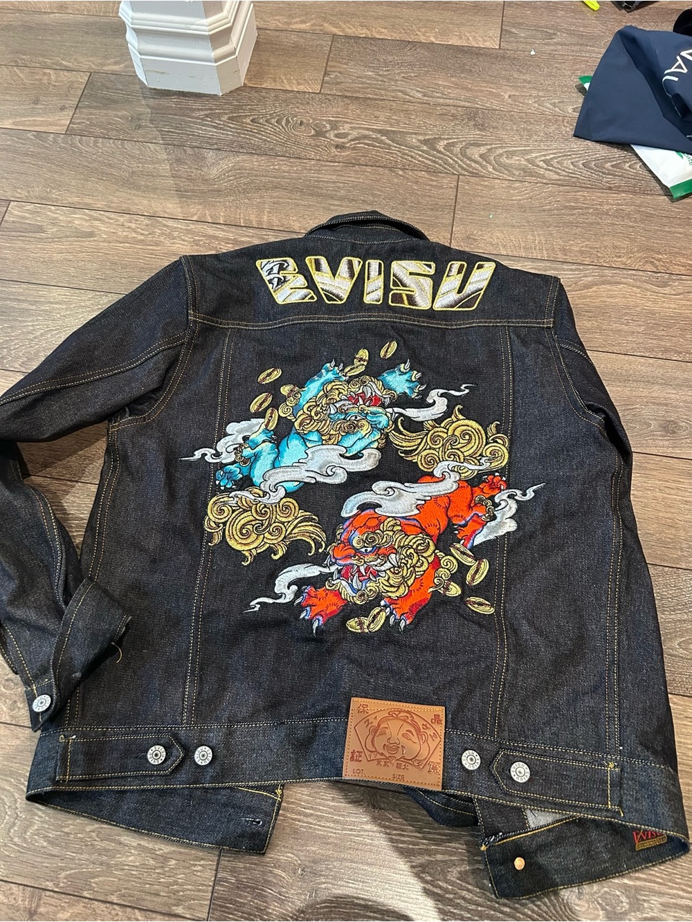 Evisu Black Denim Jacket with Blue and Red Embroidered Lion Motifs